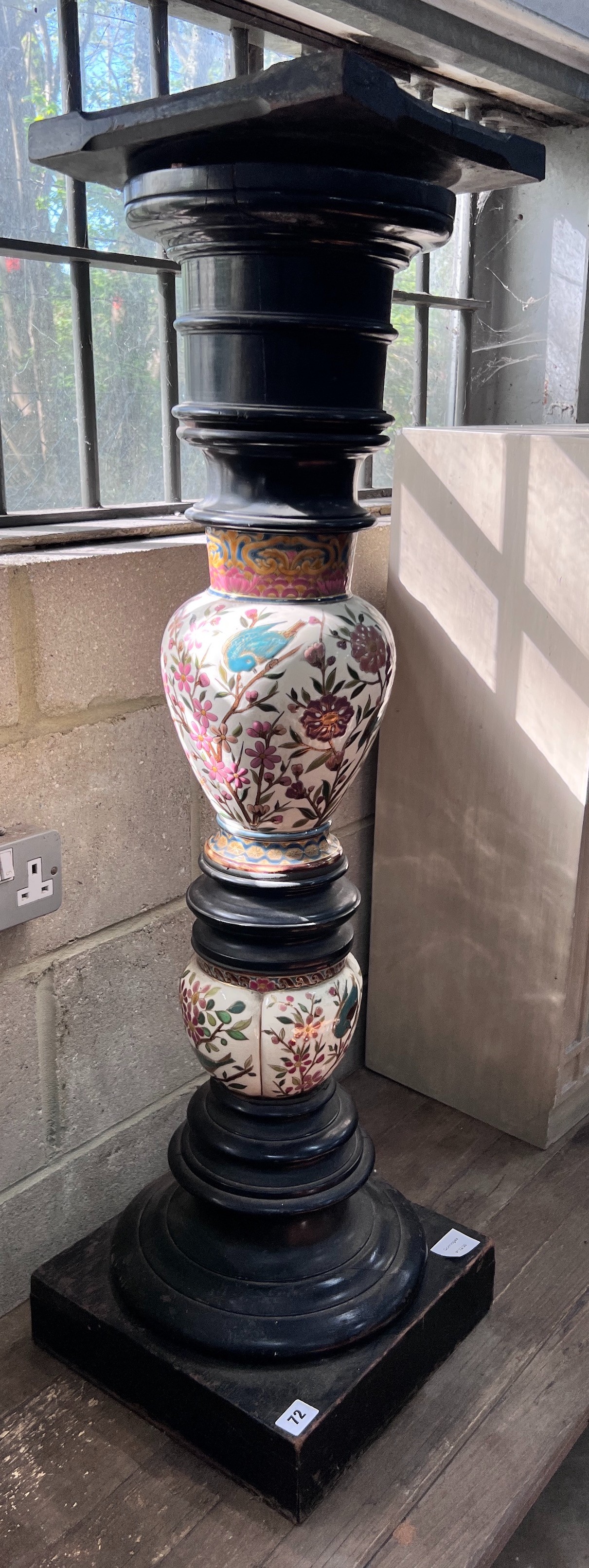 A 19th century ebonised porcelain mounted pedestal, height 105cm *Please note the sale commences at 9am.